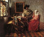 Jan Vermeer Lady Drinking and a Gentleman painting